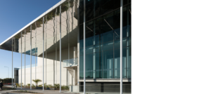 KDV Golf and Tennis Academy, front elevation detail showing mirrored soffit and reflection of pool.