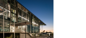 KDV Golf and Tennis Academy, front elevation, looking west at dusk.