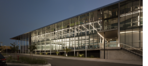 KDV Golf and Tennis Academy, front elevation, looking slightly east at dusk.